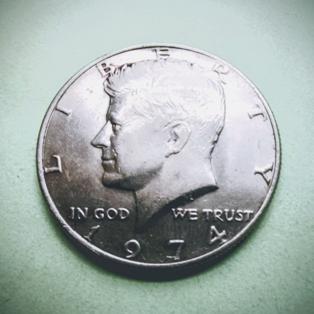 1974-P Kennedy Half Dollar Silver Tone Coin In Very Good Circulated Condition.